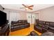 Living room with two leather sofas and hardwood floors at 6655 Durango Ct, Orlando, FL 32809