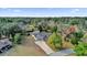 Aerial view of house, driveway, and surrounding trees at 10842 Sw 67Th Ave, Ocala, FL 34476