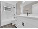 Modern bathroom with marble tile and white vanity at 10842 Sw 67Th Ave, Ocala, FL 34476