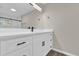Modern bathroom with white vanity and walk-in shower at 10842 Sw 67Th Ave, Ocala, FL 34476