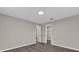 Spacious bedroom with wood-look floors and access to closet at 10842 Sw 67Th Ave, Ocala, FL 34476
