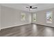 Bright bedroom with three windows and ceiling fan at 10842 Sw 67Th Ave, Ocala, FL 34476
