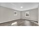 Bright bedroom with wood-look floors and large windows at 10842 Sw 67Th Ave, Ocala, FL 34476