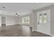 Bright living room featuring wood-look floors and a bay window at 10842 Sw 67Th Ave, Ocala, FL 34476