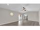 Open living room with view into kitchen and sliding door access at 10842 Sw 67Th Ave, Ocala, FL 34476