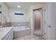 Bathroom with a garden tub and separate shower at 111 Vista Dr, Davenport, FL 33897