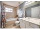 Bathroom with a shower/tub combo and a vanity at 111 Vista Dr, Davenport, FL 33897