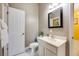 Bathroom with a vanity, toilet, and a large mirror at 111 Vista Dr, Davenport, FL 33897