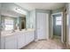 Bathroom with double sinks, a shower, and a separate tub at 111 Vista Dr, Davenport, FL 33897