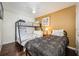 Bunk beds and twin bed in a well-lit bedroom with wood flooring at 111 Vista Dr, Davenport, FL 33897
