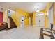 Bright entryway with tile floors and a staircase leading upstairs at 111 Vista Dr, Davenport, FL 33897