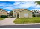 Two-story house with a paved driveway and manicured lawn at 111 Vista Dr, Davenport, FL 33897