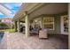 Outdoor patio with seating and access to the pool area at 111 Vista Dr, Davenport, FL 33897