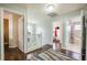 Upstairs hall with wood floors, access to bedrooms and bathroom at 111 Vista Dr, Davenport, FL 33897