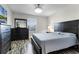 Main bedroom with dresser and large bed at 11868 Pulitzer Pl, Orlando, FL 32832