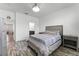 Bedroom with wood-look floors and en-suite bathroom access at 11868 Pulitzer Pl, Orlando, FL 32832