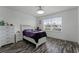 Bright bedroom with wood-look floors and a white dresser at 11868 Pulitzer Pl, Orlando, FL 32832
