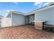 Home exterior with patio, outdoor kitchen, and gate at 11868 Pulitzer Pl, Orlando, FL 32832