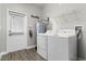 Laundry room with washer, dryer, and exterior access at 11868 Pulitzer Pl, Orlando, FL 32832