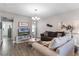 Living room with neutral color palette, two sofas, and coffee table at 11868 Pulitzer Pl, Orlando, FL 32832