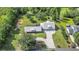 An aerial view of the home features professional landscaping, an expansive driveway, and privacy at 12788 Gillard Rd, Winter Garden, FL 34787