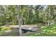 A backyard featuring a small bridge over the creek provides access to relaxing features at 12788 Gillard Rd, Winter Garden, FL 34787