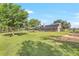 Sprawling backyard featuring a well-maintained lawn and mature trees at 12788 Gillard Rd, Winter Garden, FL 34787
