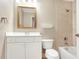 Bright bathroom with a tub and shower combination, white vanity, and gold fixtures at 12788 Gillard Rd, Winter Garden, FL 34787
