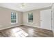 Bright bedroom with wood floors, ceiling fan, and windows providing lots of natural light at 12788 Gillard Rd, Winter Garden, FL 34787