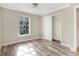 Bedroom featuring wood floors, a closet, and a nice view of the backyard at 12788 Gillard Rd, Winter Garden, FL 34787