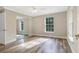 Bedroom featuring wood floors, natural light from a window, and a mirrored closet at 12788 Gillard Rd, Winter Garden, FL 34787