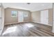 Bright bonus room featuring wood-look floors, neutral paint and ample windows at 12788 Gillard Rd, Winter Garden, FL 34787