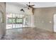 Bonus room with glass doors and tiled flooring, ceiling fan and neutral paint at 12788 Gillard Rd, Winter Garden, FL 34787
