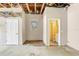 Empty garage with utility sink, open rafters, and exterior door at 12788 Gillard Rd, Winter Garden, FL 34787