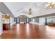 Expansive great room with hardwood floors, wainscoting, and open kitchen at 12788 Gillard Rd, Winter Garden, FL 34787