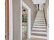 Hallway leading to bonus room with staircase to the second floor at 12788 Gillard Rd, Winter Garden, FL 34787