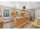 Bright kitchen featuring stainless steel appliances, wood cabinets, and granite countertops at 12788 Gillard Rd, Winter Garden, FL 34787