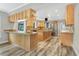 A large kitchen featuring a granite countertops, stainless appliances, and ample cabinet space at 12788 Gillard Rd, Winter Garden, FL 34787