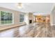 A bright living area with a fireplace, lots of natural light, and direct kitchen access at 12788 Gillard Rd, Winter Garden, FL 34787