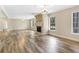 A bright, open living space with a fireplace, large windows, and neutral paint tones at 12788 Gillard Rd, Winter Garden, FL 34787
