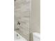 Close-up of the shower featuring tiled walls and modern hardware at 12788 Gillard Rd, Winter Garden, FL 34787