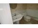 Small bathroom with pedestal sink and toilet at 1450 Warrior Trl, Deltona, FL 32725