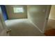 Simple bedroom with carpeted floors and blue accent wall at 1450 Warrior Trl, Deltona, FL 32725