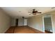 Large bedroom with hardwood floors and ceiling fans at 1450 Warrior Trl, Deltona, FL 32725