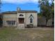 Two-story house with stone accents and a large front yard at 1450 Warrior Trl, Deltona, FL 32725