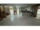 Open kitchen with island, white cabinets, and tile floors at 1450 Warrior Trl, Deltona, FL 32725
