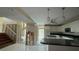 Open concept kitchen with island and breakfast bar at 1450 Warrior Trl, Deltona, FL 32725