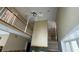 View of a two-story living room with a fireplace at 1450 Warrior Trl, Deltona, FL 32725