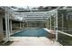 Enclosed pool area with a pool cover at 1450 Warrior Trl, Deltona, FL 32725