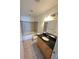 Bathroom with tiled floors and shower/tub combo, and vanity with dark countertop at 150 E Robinson St # 1411, Orlando, FL 32801